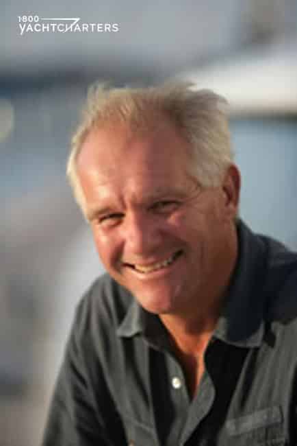 Award-winning sailboat designer Ed Dubois photograph. It is just his head, and he is smiling at the camera.