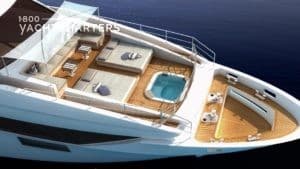 Aerial photograph of a yacht with a hot tub at the front.