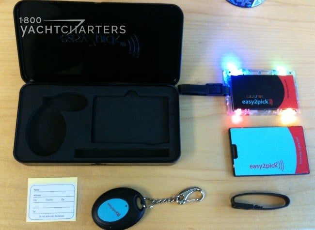 Photograph of the Easy2Pick Wireless Luggage Finder System. All of the pieces are sitting on a table. There are 6 pieces.
