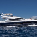 Seawater Sunseeker motoryacht with blue hull running to the right
