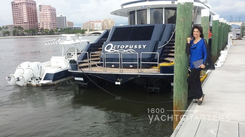 jana sheeder 1800yachtcharters president stands on dock beside motoryacht octopussy before inspection