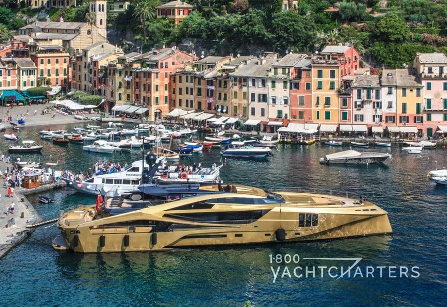 KHALILAH gold yacht anchored in Portofino and surrounded by multiple smaller yachts