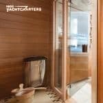 yacht wellness room that looks out on the ocean - wooden floors and glass doors
