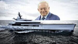 Photograph of a white yacht. It is facing the right side of the photograph. There is a large headshot photo of the yacht owner superimposed over the top portion of the photo and resting on the yacht